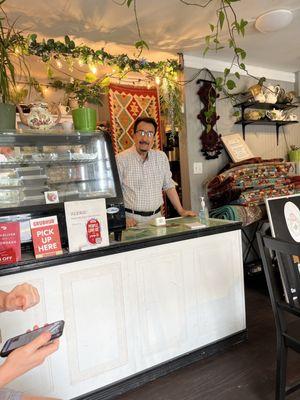 Hamada, the owner behind the counter