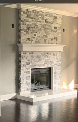 Modern Indoor Fireplace with mantle and base created by Long Island 5 Star Masonry & Construction Inc.