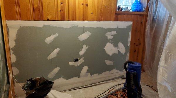 We couldn't replace the paneling so opted for drywall because it was much easier to find and way cheaper