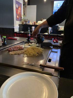 Hibachi cooking. Veggies included zucchini, mushrooms, and onions