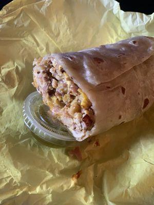 Breakfast burrito with ham, potato, egg and cheese