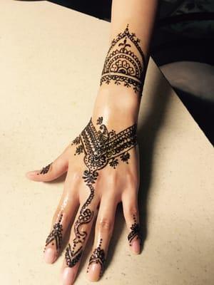 Beautiful Henna tattoo on her hand