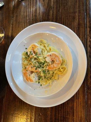 Tagliatelle with homemade egg noodles along with lemon zest, lemon juice, butter and delicious shrimp.