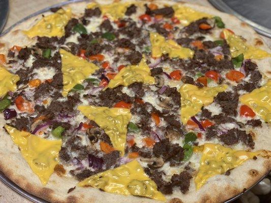 Cheese steak pizza