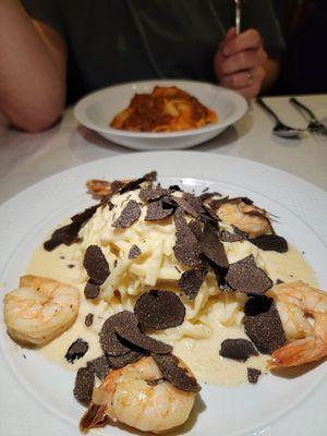 Cheese wheel pasta with shaved truffle and shrimp