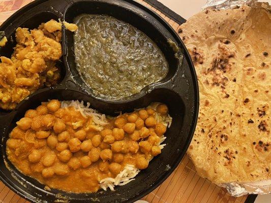 Vegetarian Platter with spinach, chick peas and cauliflower. Roti on the side.