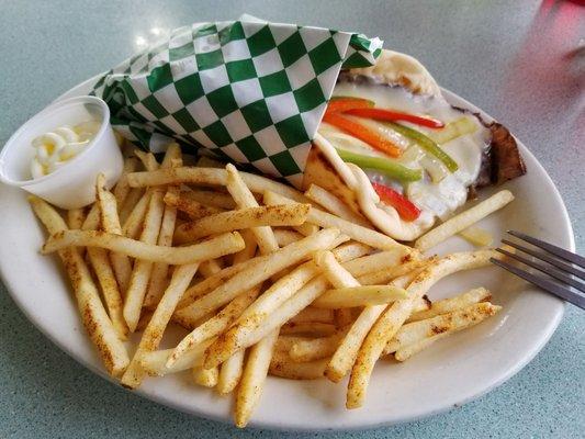 A gyro cheeseburger with pita bread.