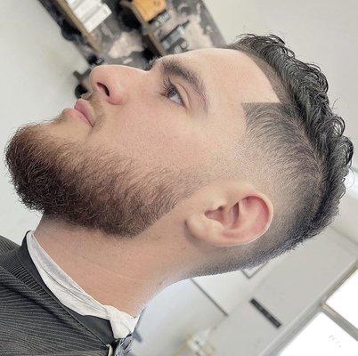 Mid drop skin fade with beard line up