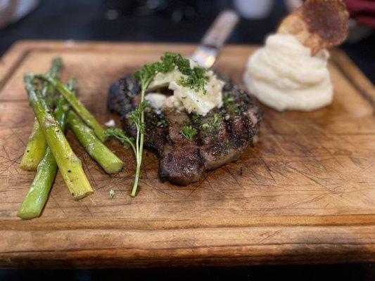 12oz ribeye, mash potatoes, asparagus, garlic butter topping