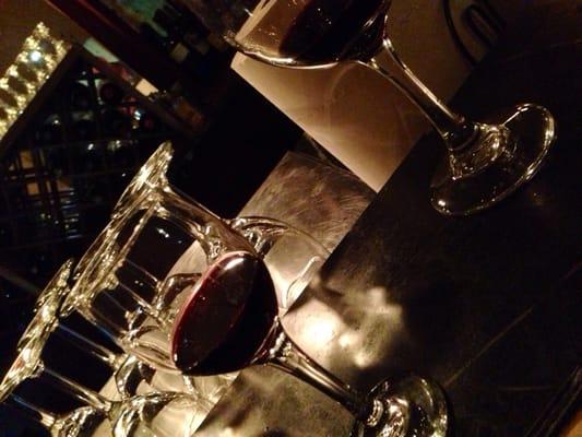 Wine samples at the bar.