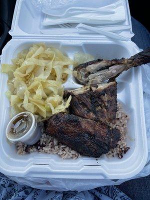 Jerk Chicken dinner with cabbage and Rice & Peas