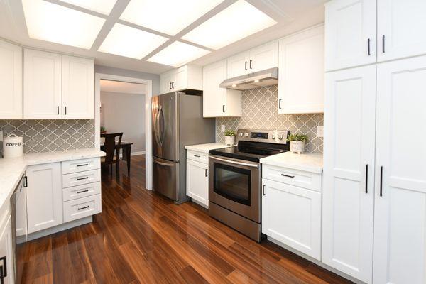 All new cabinets, sink, and backsplash. We kept our old appliances.