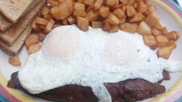 Eggs -- over easy with Corned Beef Hash.