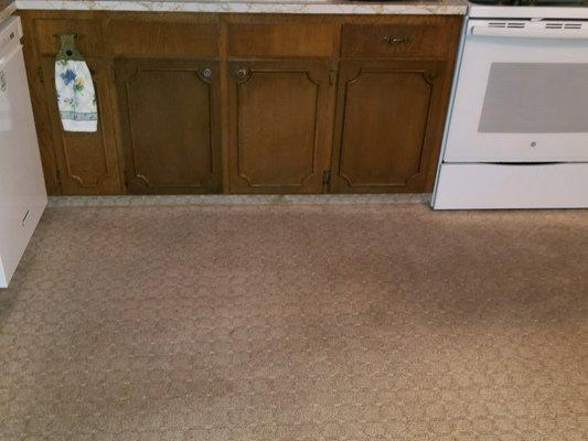 Customer's kitchen before cleaning the carpet