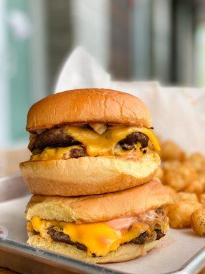 Daddy's Burger with caramelized onions, American Cheese and pickles