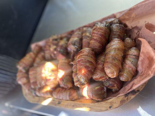 Armadillo eggs (jalapeño stuffed with cream cheese and brisket wrapped in three pieces of bacon.