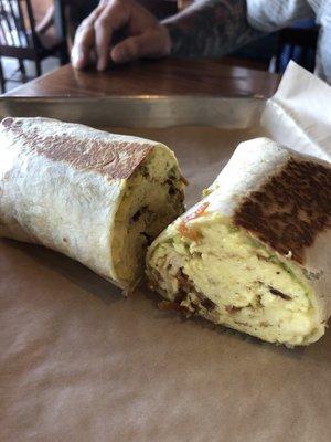 Boardwalk burrito : scrambled eggs, hash browns, bacon,  avocado, white cheddar