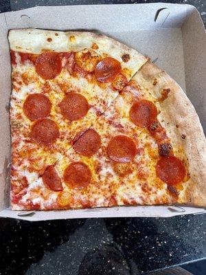 A slice of Pepperoni cut in two