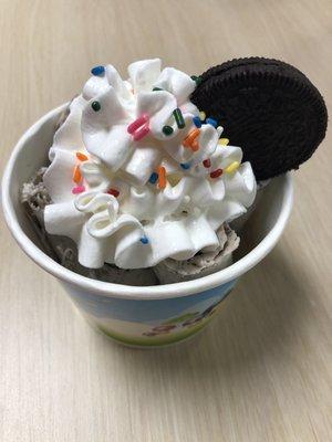 Fresh ice cream mix with a piece of Oreo make in rolled ice cream with whipping cream sprinkles and Oreo on top. Yummy