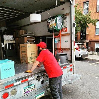 Our Moving Specialist making sure everything in the truck is well organized.