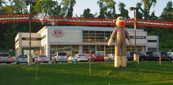 Check out our giant sock monkey at Century 3 Kia