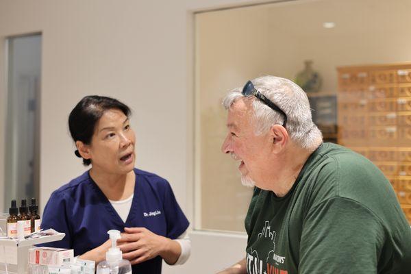 Dr. Liu communicates with patient.