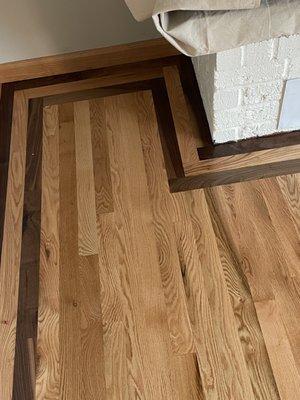 They did a fabulous job of blending an existing wood floor with a new