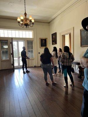 Interior of mansion and our knowledgeable tour guide