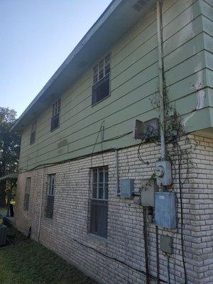 Tearing down all wires and putting up new siding, sealing then painting