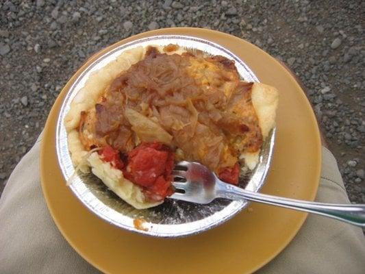 a partially eaten tomato pie