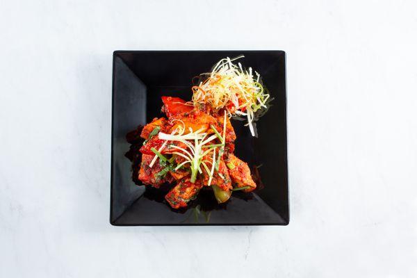 Chili Paneer. Seasoned fried Indian cottage cheese (paneer) in a tangy chili sauce.