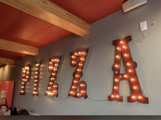 Cool pizza sign in dining room