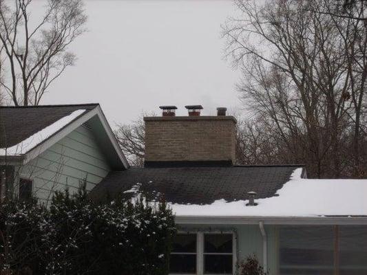 Tore down and rebuilt chimney from the roof-line up. Also installed new chimney caps