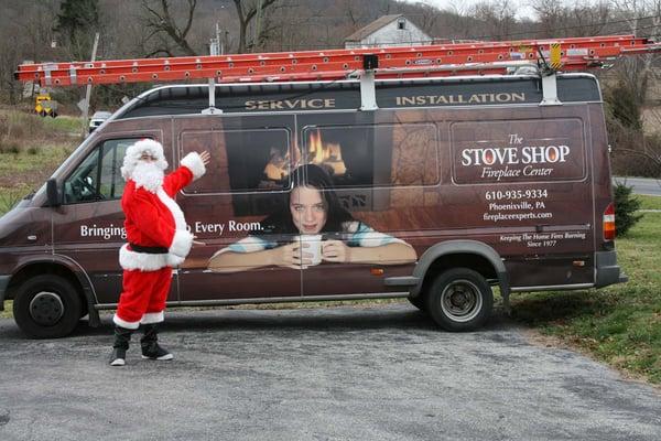 Santa Clause next to the Stove Shop installation van. Happy Holidays from the Stove Shop!