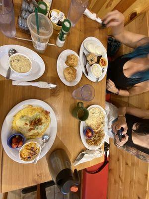 Poached eggs, Veggie Frittata, avocado bacon Avocado, Bacon, Pepper Jack Frittata with cheesy grits and Sausage Gravy (Cup)