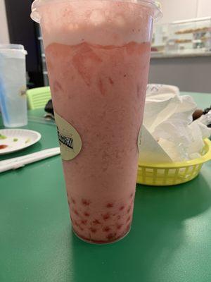 strawberry 22 oz. Milk Tea with strawberry popping boba