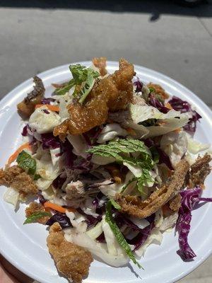 Our Vietnamese Chicken salad! Sautéed chicken chicken skins over fermented cabbage! Don't sleep on this one!