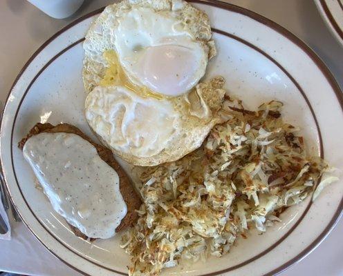 High Country breakfast with country fried steak, 2 eggs, hash browns, choice of toast.