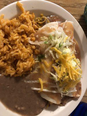 Beef and Bean Burritos smothered in green chili with Rice and Beans.