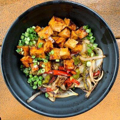 Rice bowl with sautéed veggies and tofu