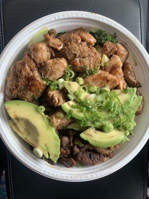 Steak and chicken bowl with avocado.