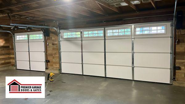 Freshly installed double and single garage doors with sleek side-mounted openers, ensuring smooth operation of the garage doors.