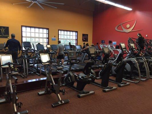 Large aerobic workout area with treadmills and bikes.