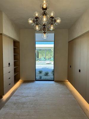 Motorized shade in closet with custom size and fabric to enhance the rooms design.