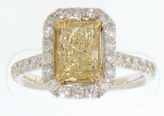 Beautiful Intense Yellow diamond center with round brilliant diamonds.