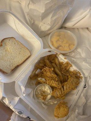 Slice of white bread, deep fried cod, soggy fries and frozen Mac & Macaroni cheese