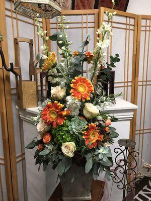 Big arrangement , created using gerberas , delphiniums, roses , succulents and greenery.