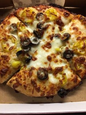 White pizza with banana peppers and olives