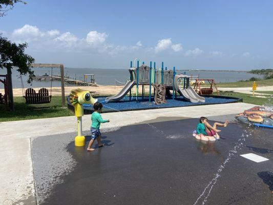 Splash pad, playground, fishing pier/dock and boat ramp (to right of pier). Lots and of fun for both kids and adults.