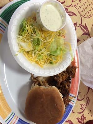 Pulled Pork Sandwich ($4.95) with added side salad with ranch